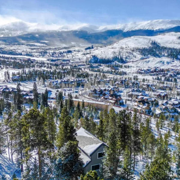 Aerial view of the A-frame in winter, with Breckenridge and the Ten Mile Range beyond